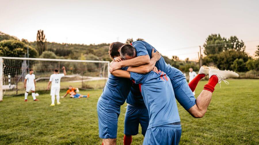 Insight management for the world - a soccer team celebrates for their recent victory.
