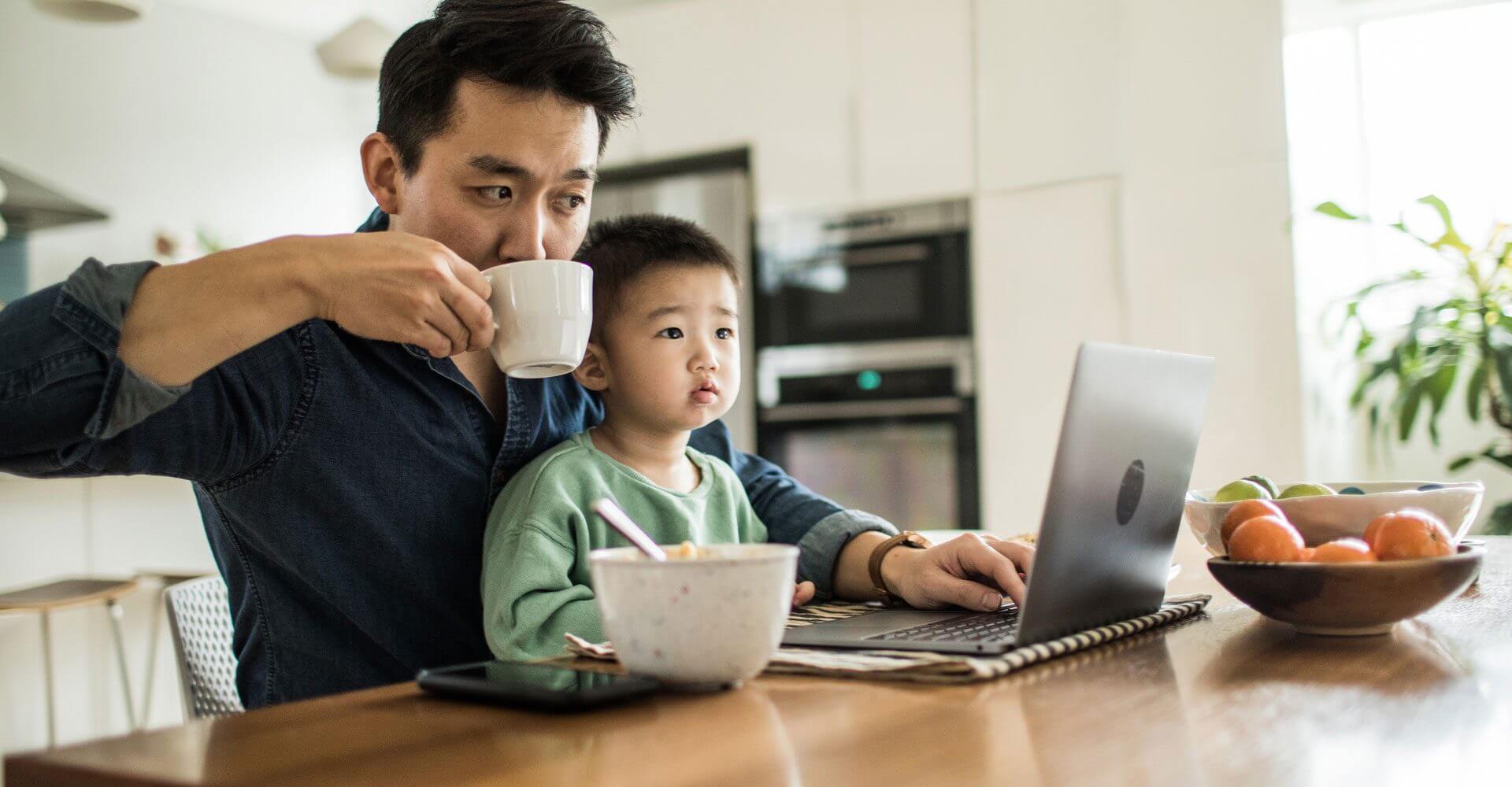 A father works remotely with his son on his life.