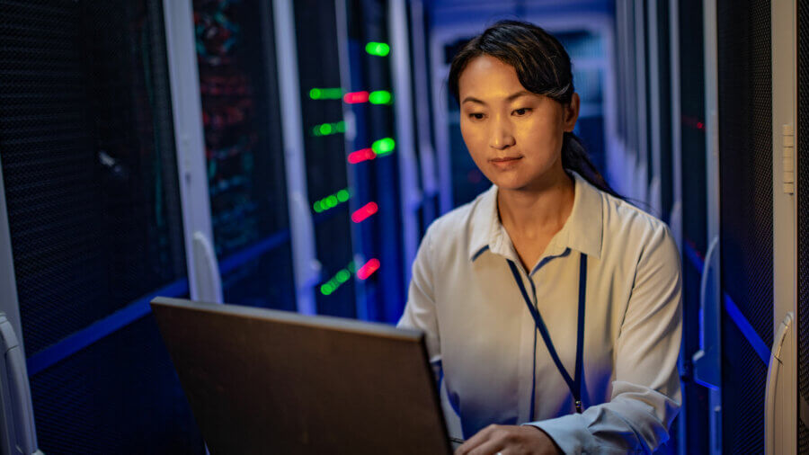 ESG Initiatives in Chinese Data Centers, woman shown working in a data center