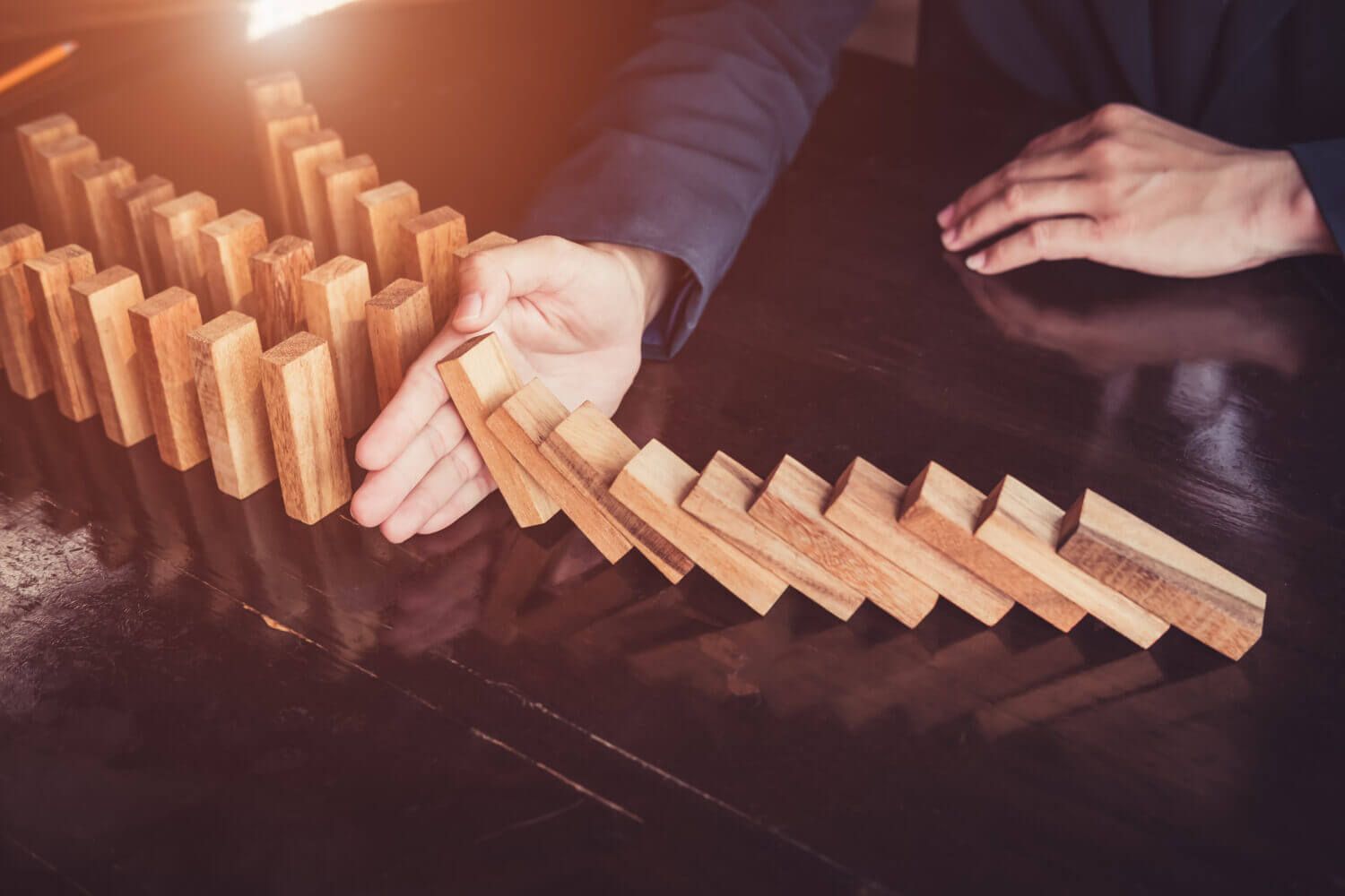 Business man placing wooden block on a tower concept risk control, Planning and strategy in business. Alternative risk concept, Risk To Make Business Growth Concept With Wooden Blocks