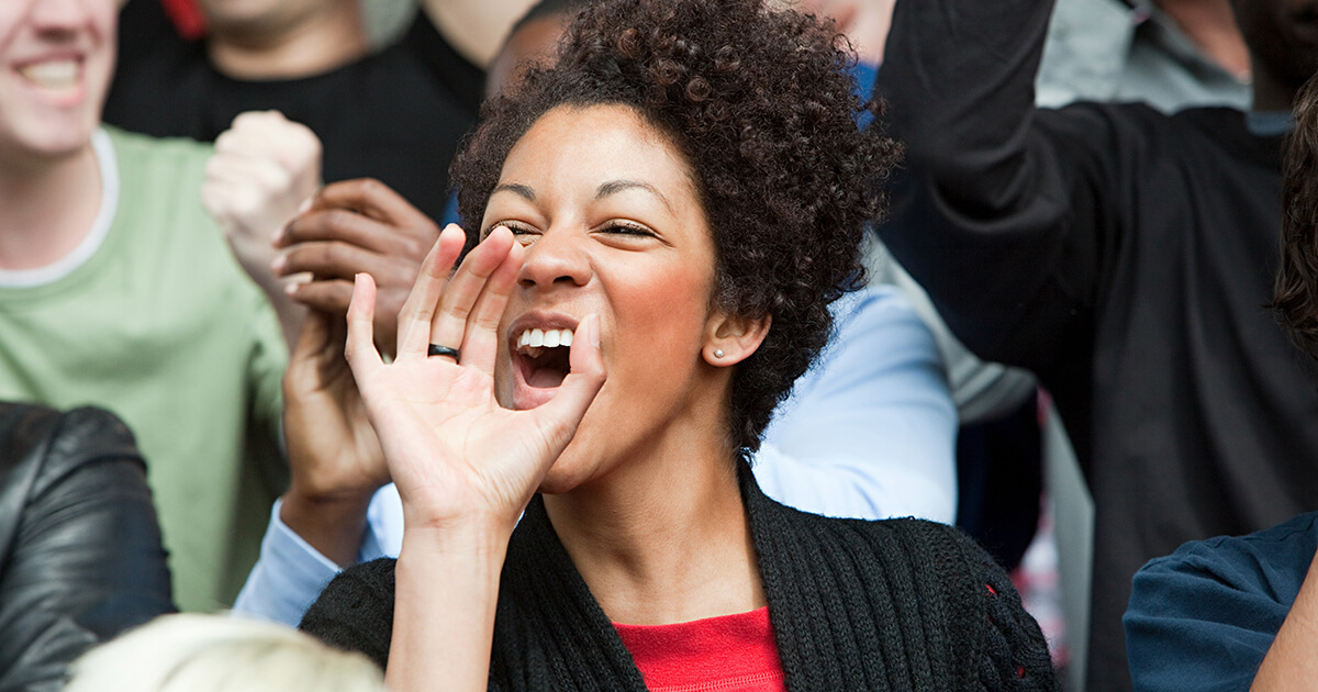 Shouting woman at football match