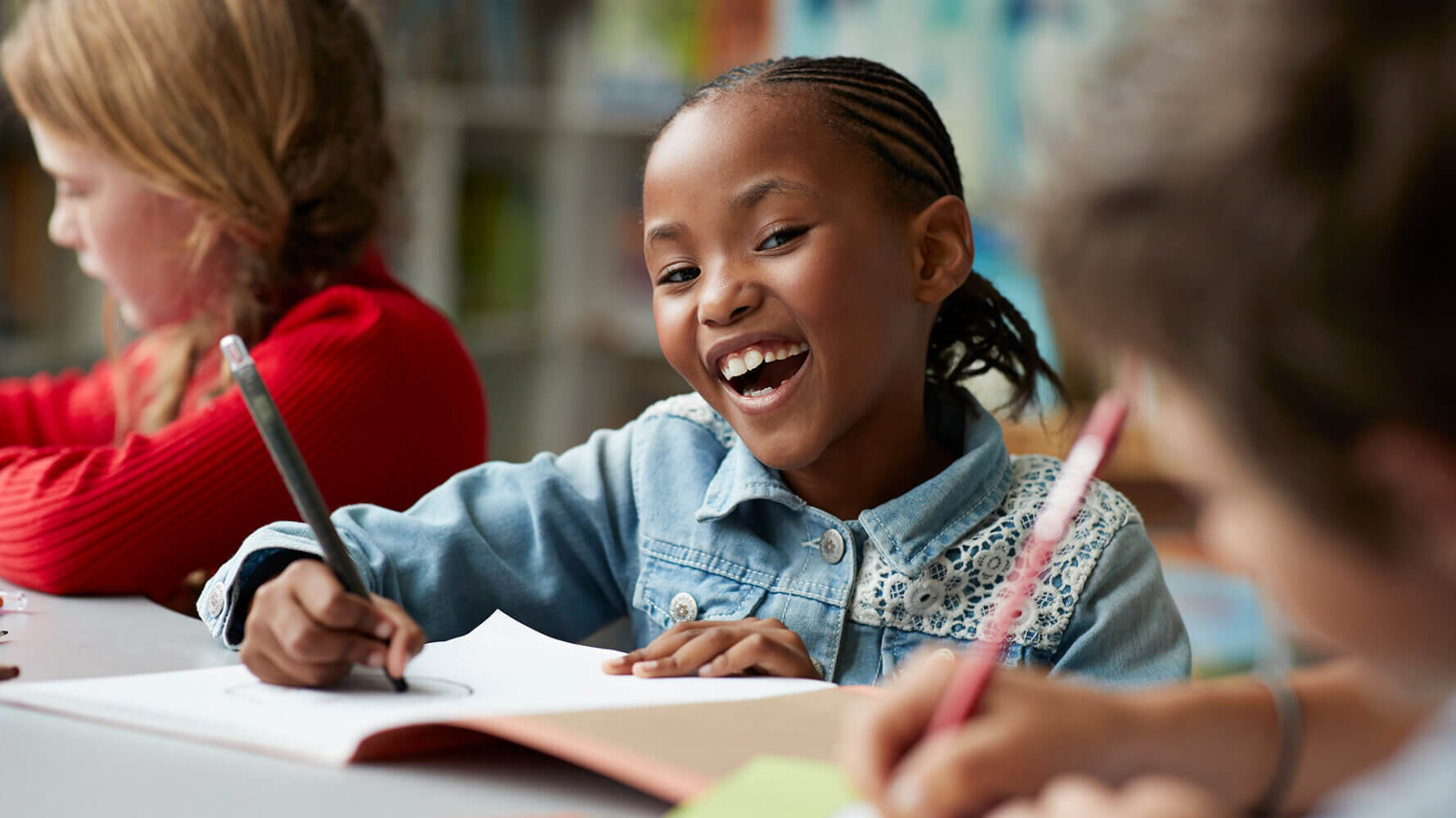 Charter schools student working with classmates.