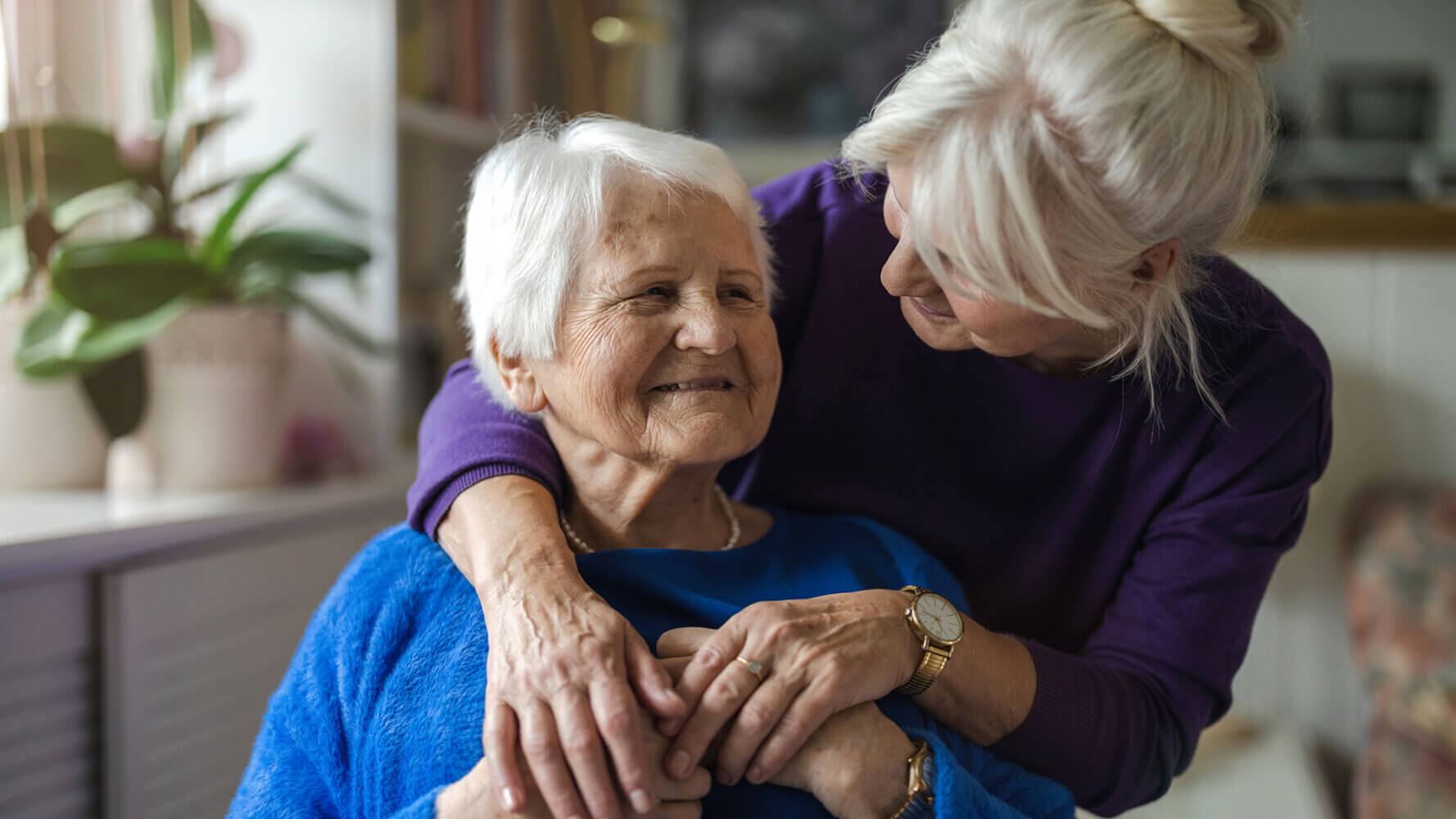 The silent generation represented by two ladies hugging.