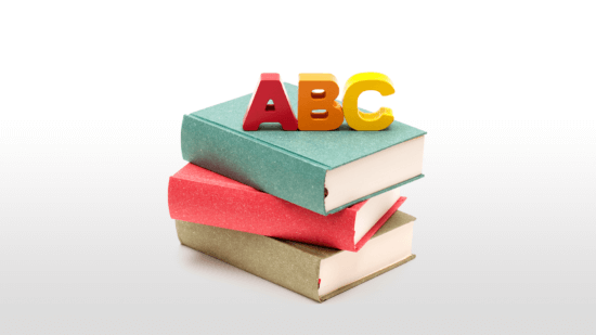 ABC letters atop a stack of books