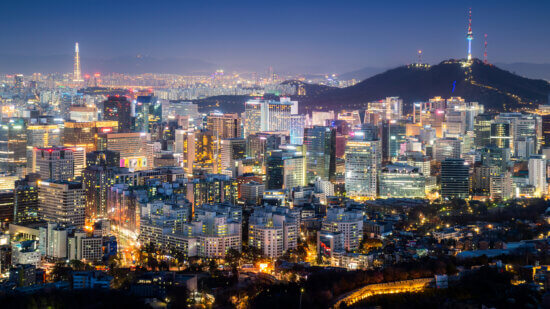 Panorama of Seoul downtown cityscape illuminated with lights and Namsan Seoul Tower in the evening view from Inwang mountain. Seoul, South Korea.