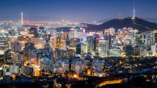 Panorama of Seoul downtown cityscape illuminated with lights and Namsan Seoul Tower in the evening view from Inwang mountain. Seoul, South Korea.