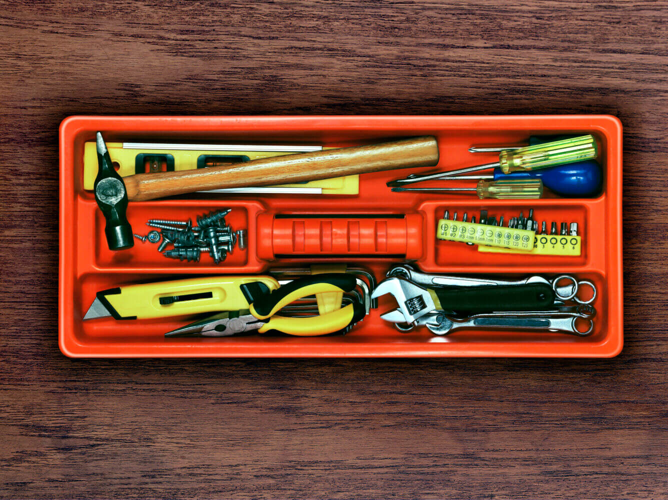 A Diy Tool Tray containing hammers, screwdrivers, pliers, level, spanners and screws