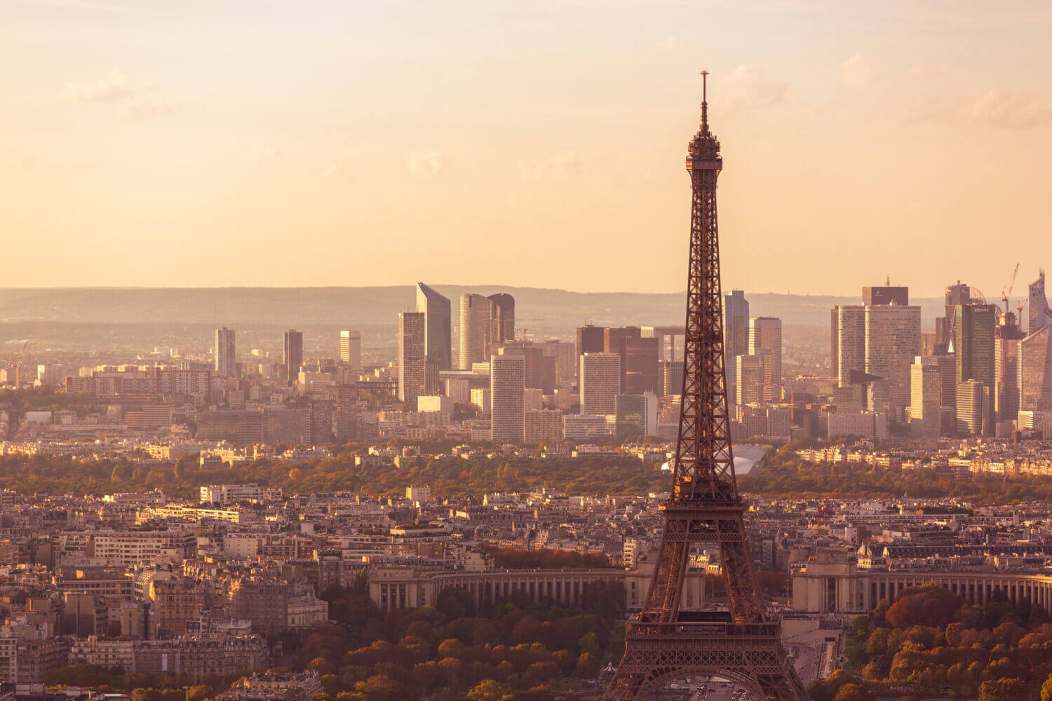 Close-up of Eiffel Tower and skyscrapers of La Defense financial district, Paris, France