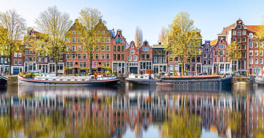 Reflections in the morning on a canal of Amsterdam, Holland