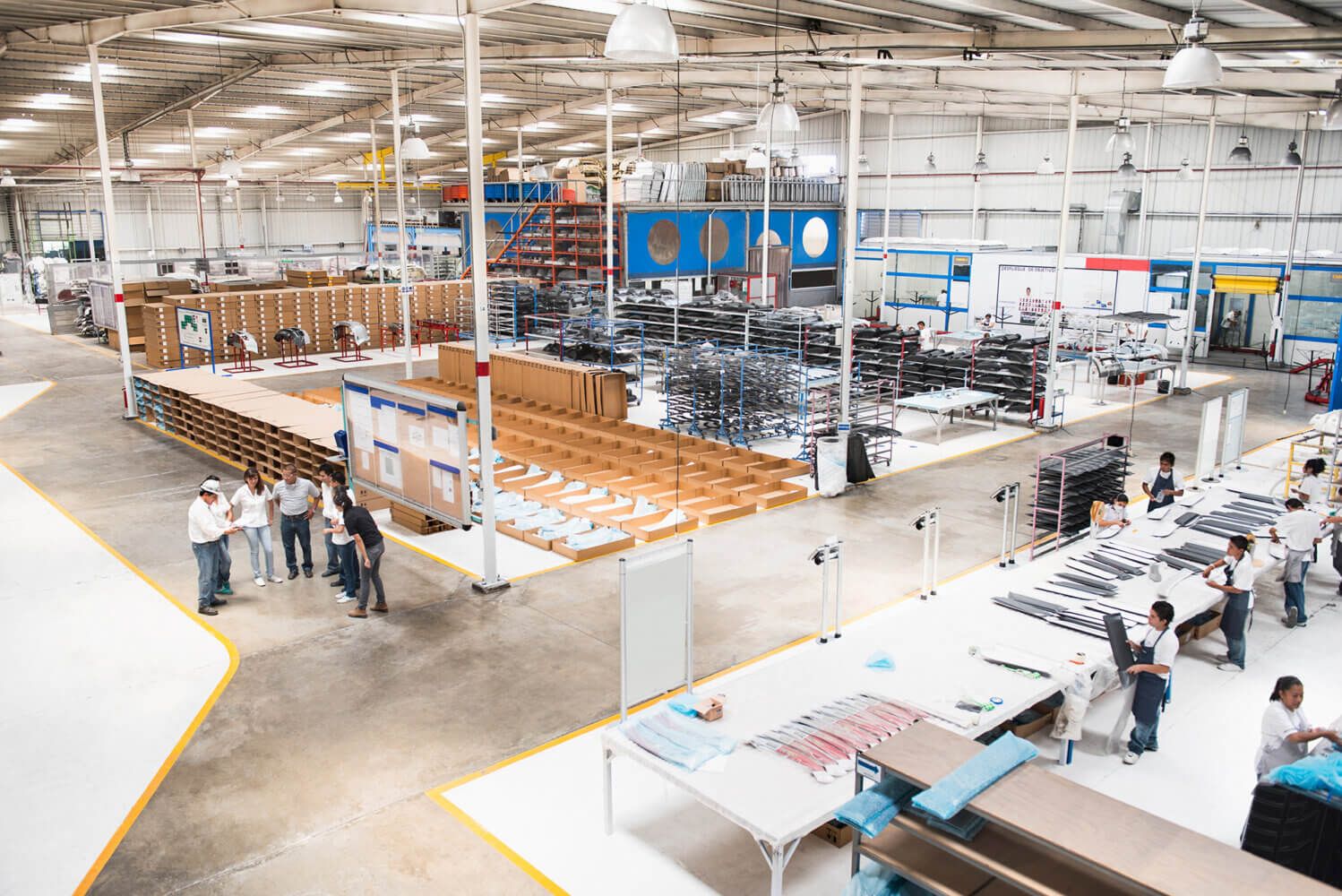 Booming Mexican Real Estate, Overhead view of factory workers in a manufacturing plant.