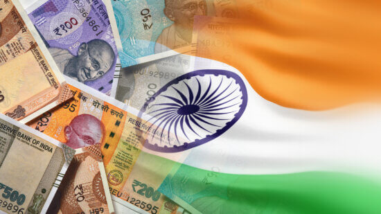 The Indian flag overlays some cash bills from India
